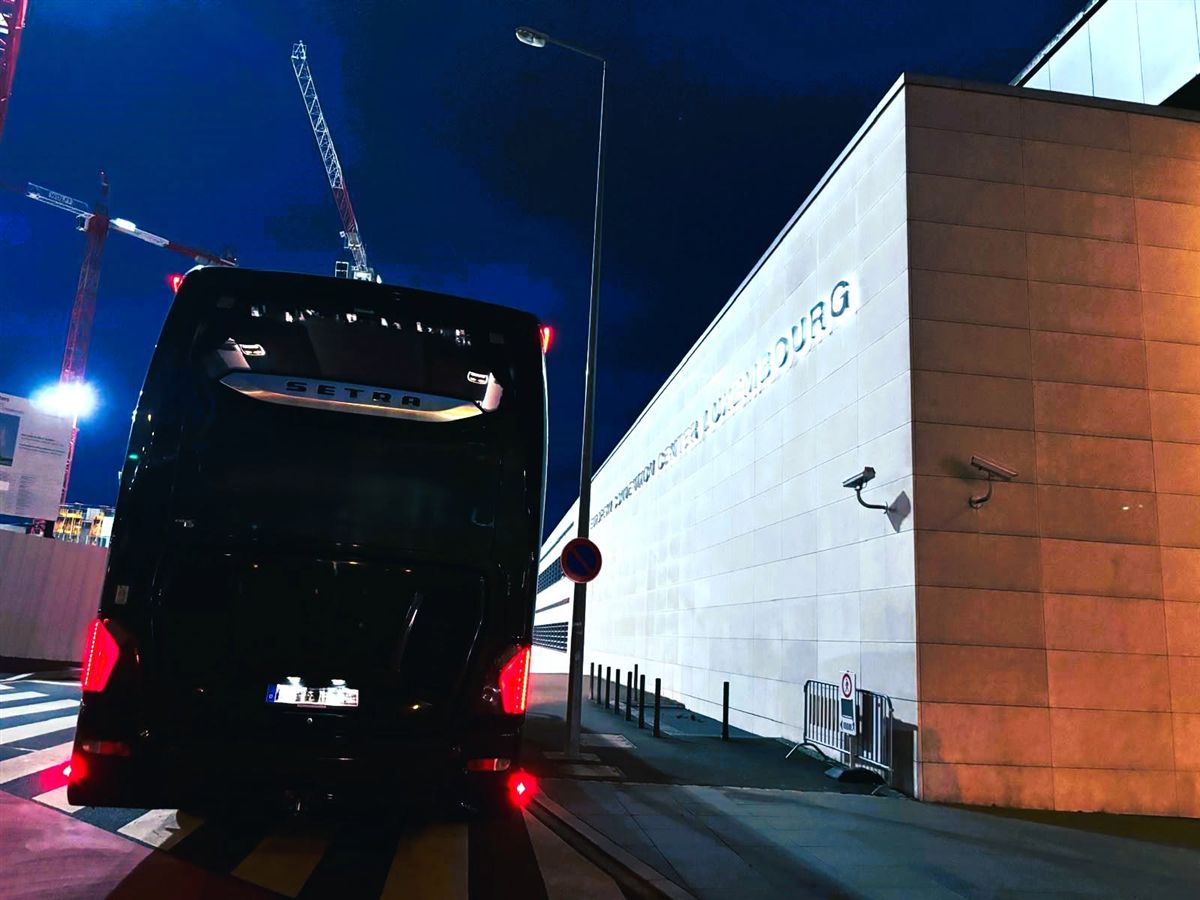 Coach in front of the Philharmonie Luxembourg at night